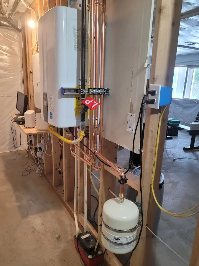 Licensed plumber repairing a kitchen sink in Elizabeth