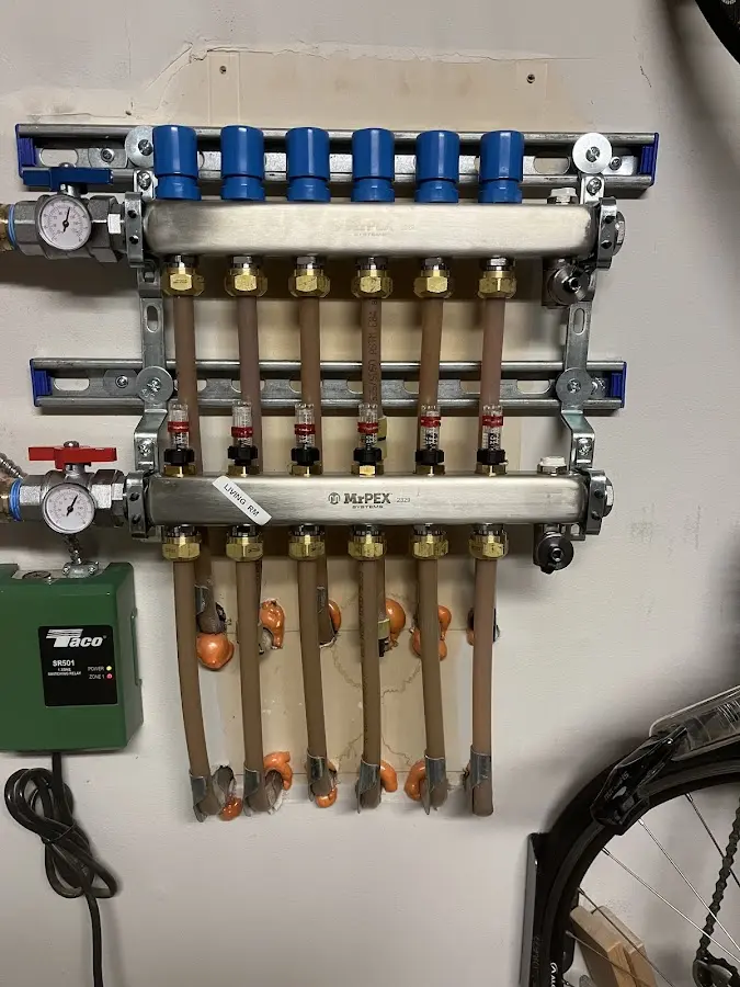 Plumber performing Water Heater Repair at a residential property in Elizabeth